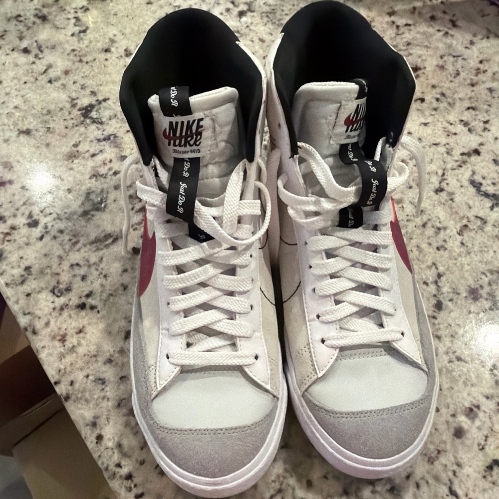 Nike White High-Top Sneakers with Pink Swoosh